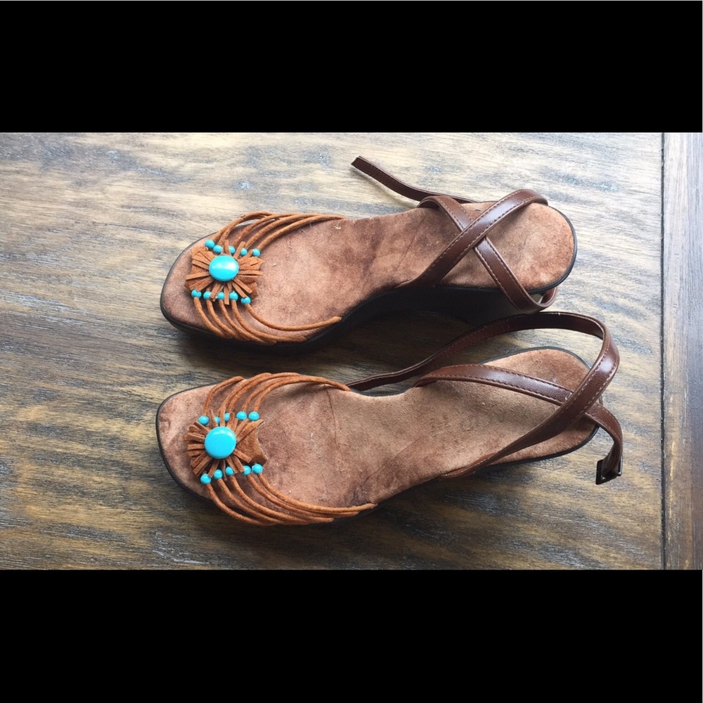 Suede upper with turquoise accents.